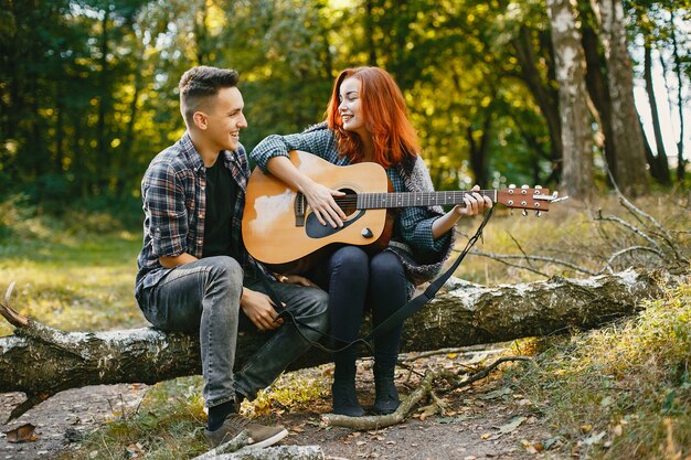 Beautiful couple spend time in a summer park