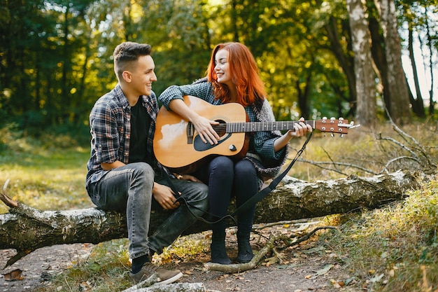 Beautiful couple spend time in a summer park