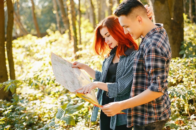 Beautiful couple spend time in a summer park