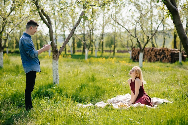 Beautiful couple spend time in a summer park