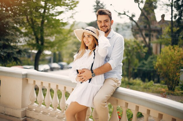 Beautiful couple spend time in a summer park