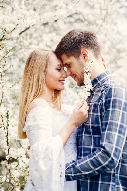 Beautiful couple spend time in a summer park