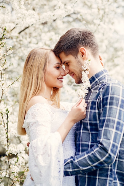 Beautiful couple spend time in a summer park