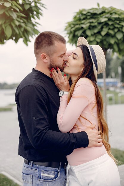 Beautiful couple spend time in a summer park