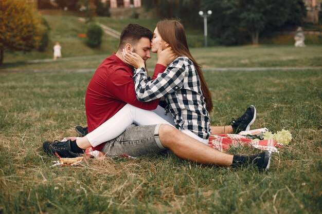 Free photo beautiful couple spend time in a summer park