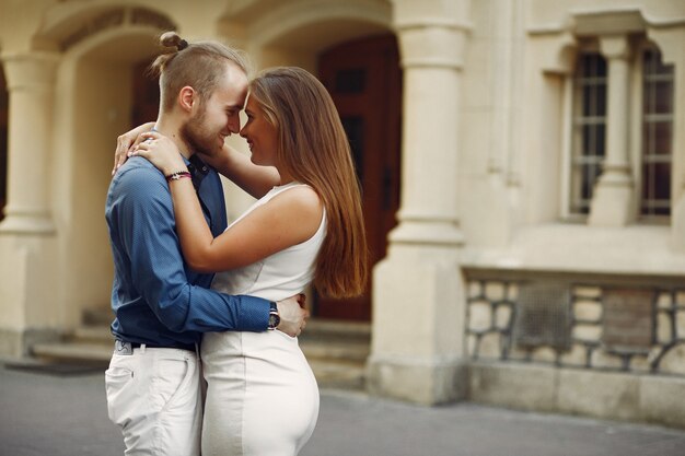 Beautiful couple spend time in a summer park