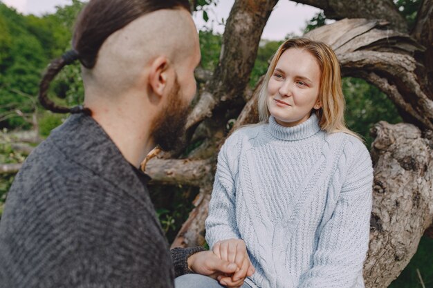 Beautiful couple spend time in a summer park