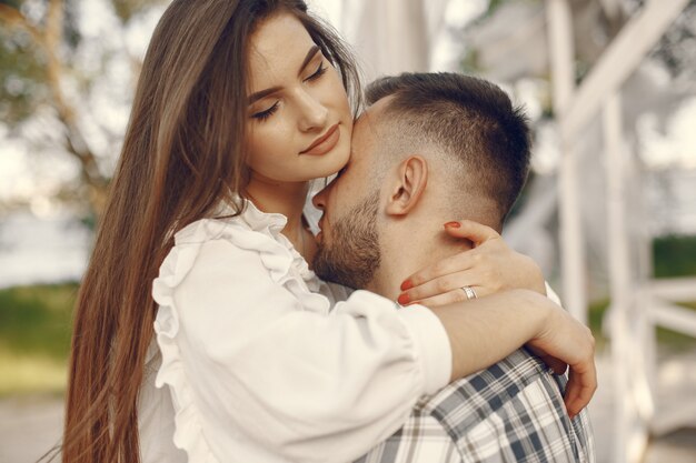 Beautiful couple spend time in a summer park