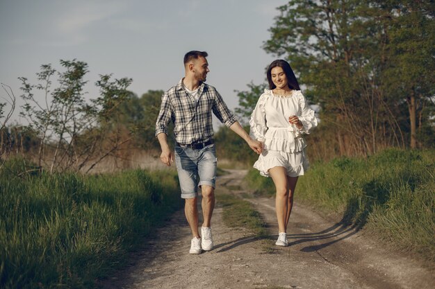 Beautiful couple spend time in a summer park