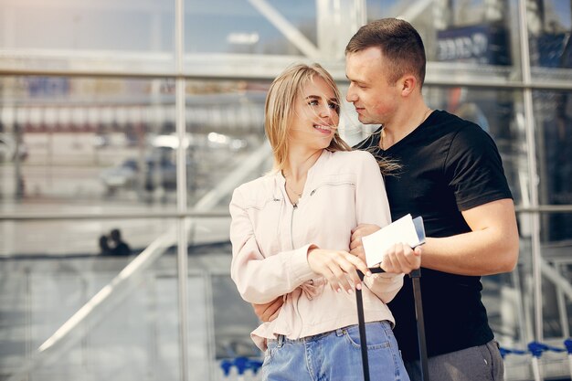 Beautiful couple standing in a airport