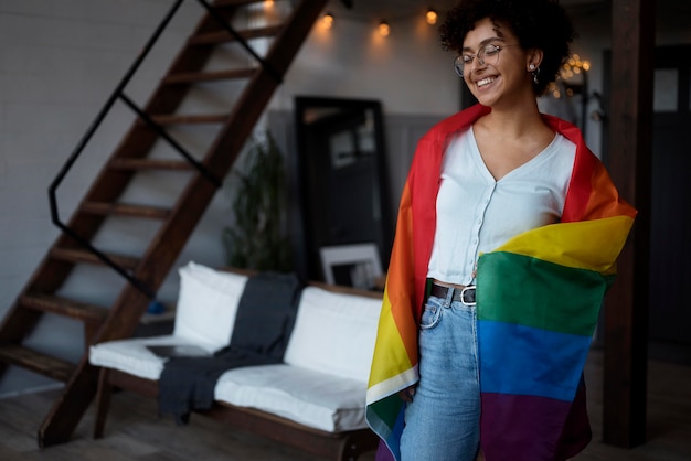 Free Photo beautiful curly woman with lgbt flag