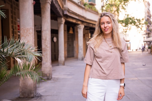 Free photo beautiful cute woman staying on the street