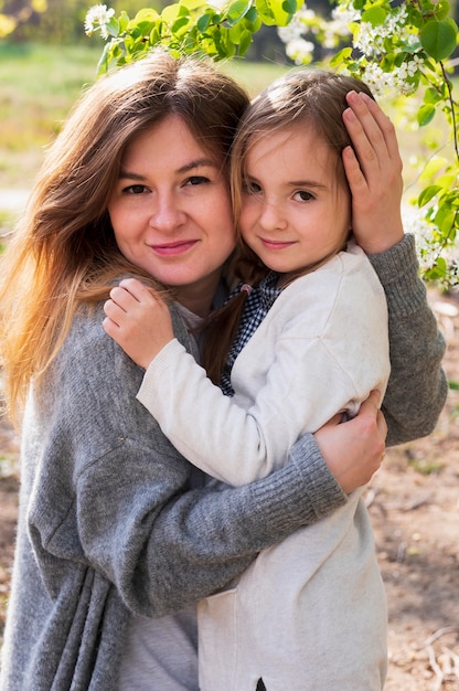 Beautiful daughter and mother posing