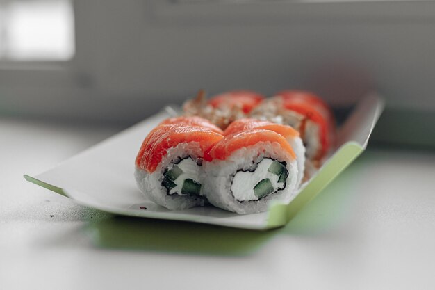 Beautiful delicious sushi Sushi delivery Advertising sushi rolls made of fish and cheese