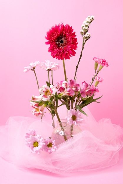 Free photo beautiful different flowers and pink veil