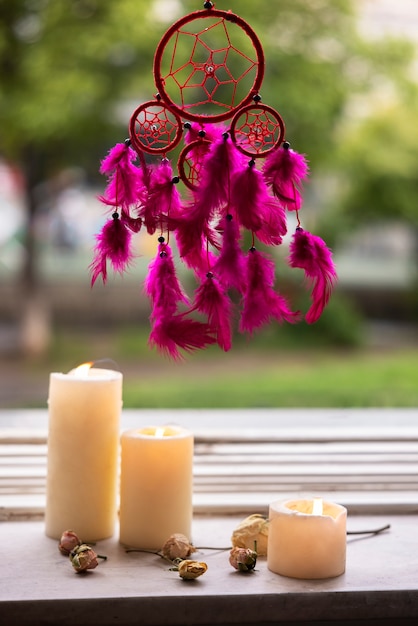 Free photo beautiful dream catcher and candles outdoors