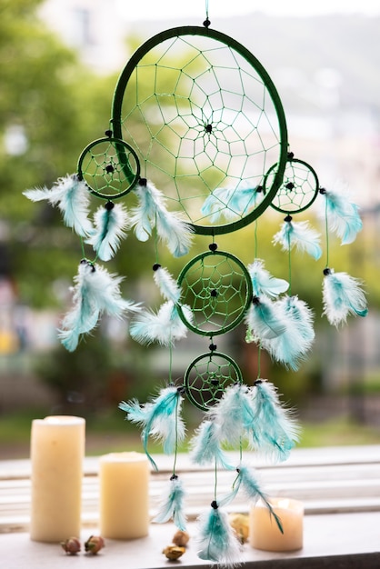 Free photo beautiful dream catcher and candles outdoors