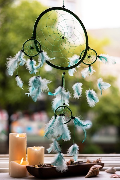 Free Photo beautiful dream catcher and candles outdoors