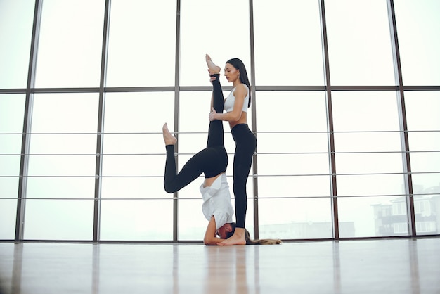 Beautiful and elegant girls doing yoga