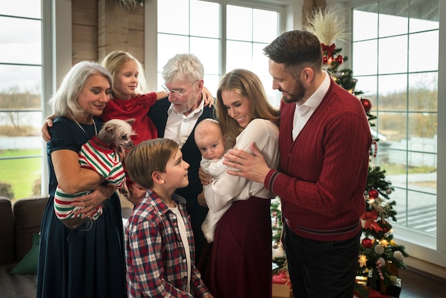 Free photo beautiful family enjoying christmas together at home