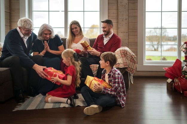 Free photo beautiful family enjoying christmas together at home