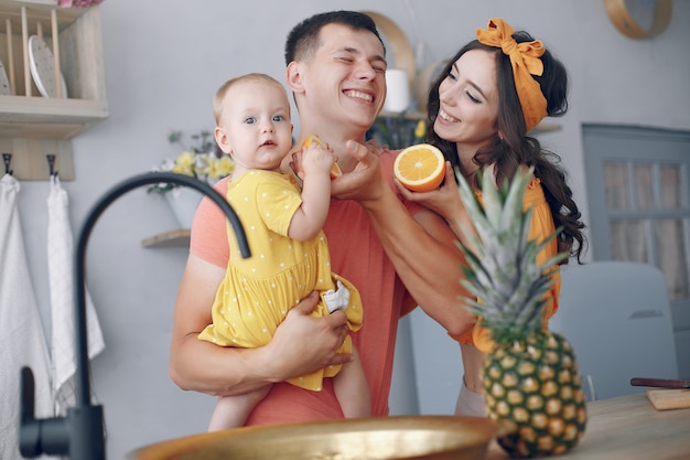 Beautiful family prepare food in a kitchen