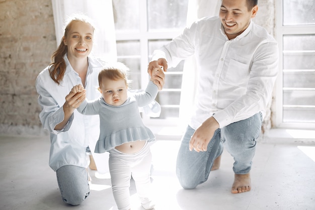 Free photo beautiful family spend time in a bedroom