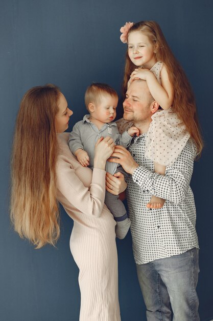 Beautiful family spend time in a bedroom