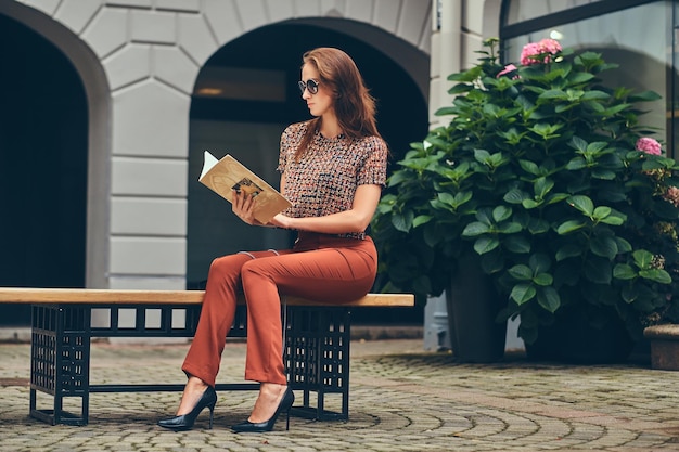 Free Photo beautiful fashionable brunette wearing trendy clothing and sunglasses.