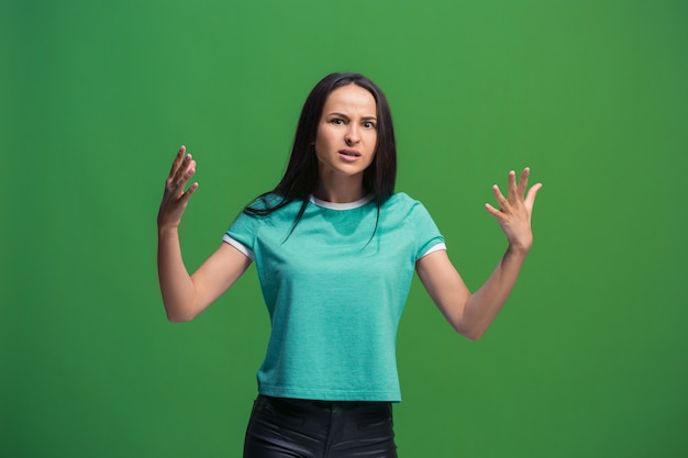 Beautiful female half-length portrait isolated on green studio