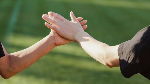 Beautiful female hands high five