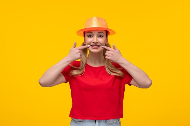 Beautiful female in red tshirt with orange hat smiling yellow background girl cartoon