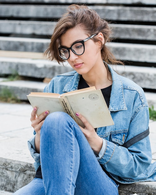 Beautiful female studying outdoors