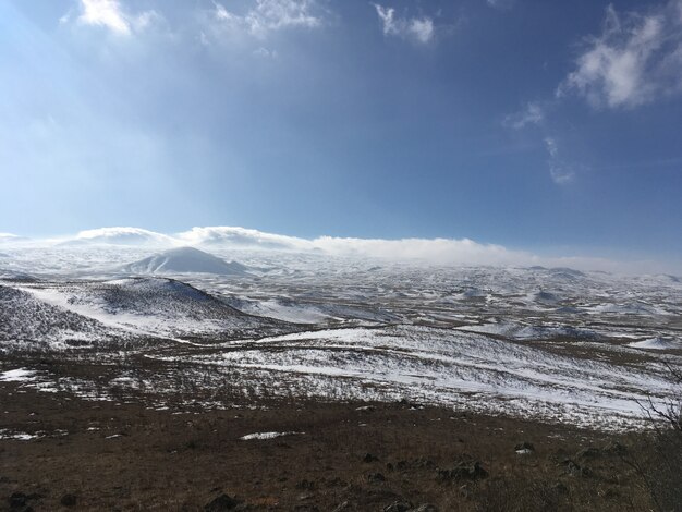 Beautiful fields covered in snow and amazing cloudy sky