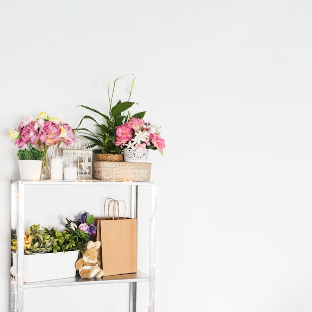 Beautiful flowers arranged on shelf