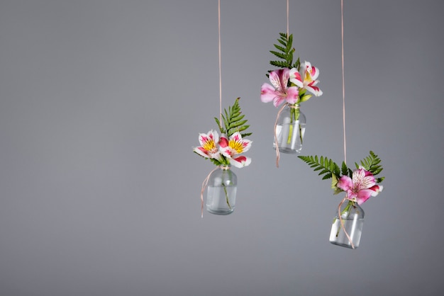 Beautiful flowers arrangement hanging by thread