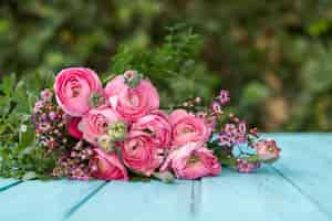 Free photo beautiful flowers on blue surface