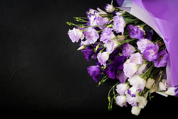 Free photo beautiful flowers bouquet mix of white, purple and violet eustoma.