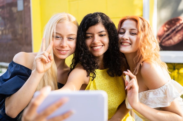 Beautiful friends taking a selfie