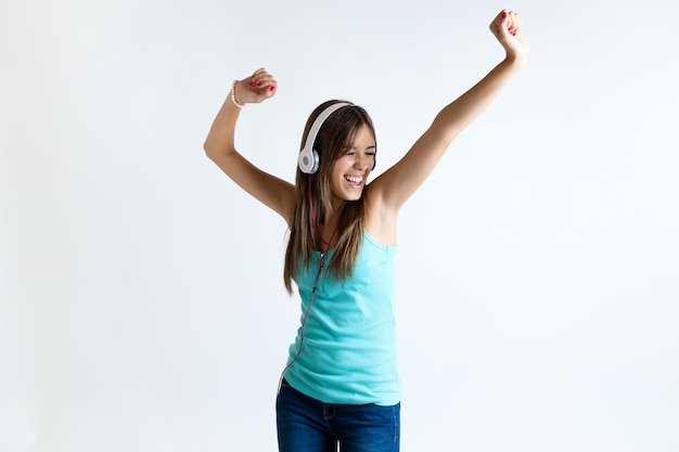 Free photo beautiful girl dancing and listening to music. isolated on white