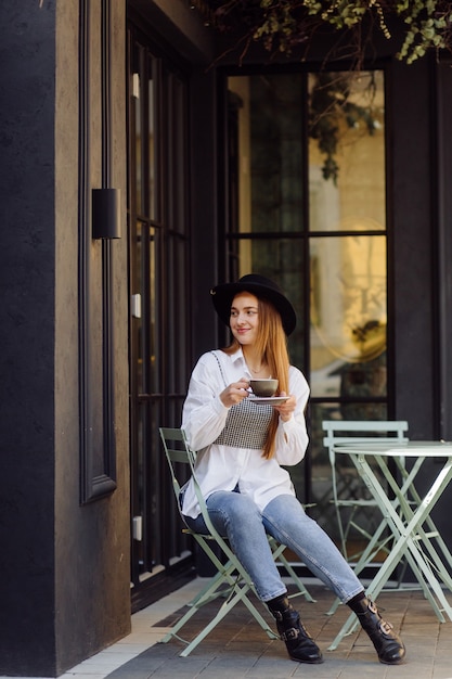 Free Photo beautiful girl having coffee at cafe