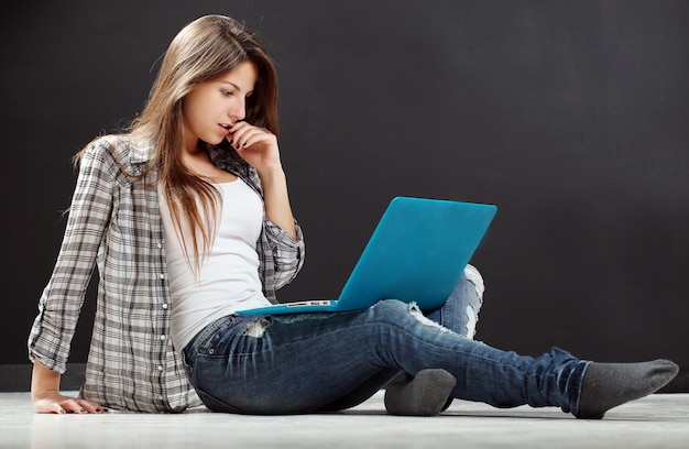 beautiful girl look at laptop