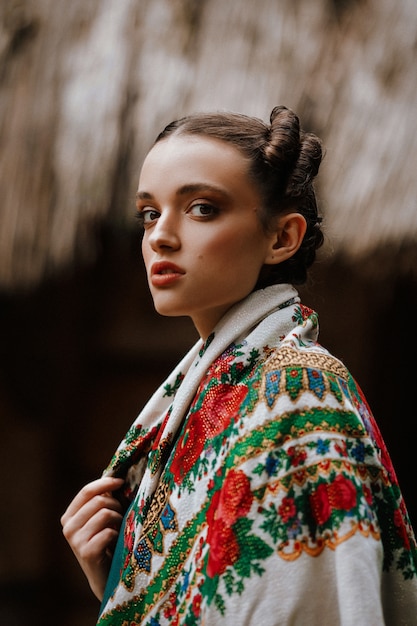 Free Photo beautiful girl posing in an embroidered dress