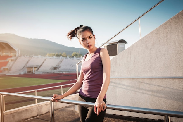 Beautiful girl posing with sports clothes