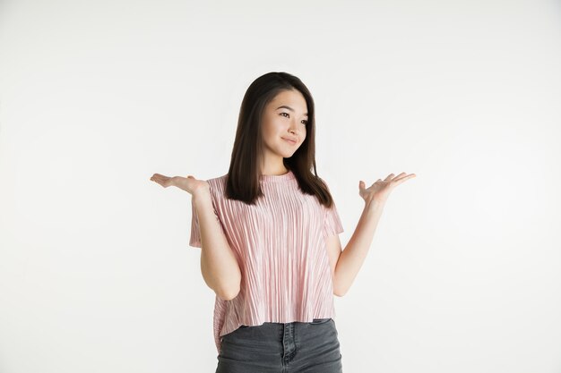 Beautiful girl's half-length portrait on white studio