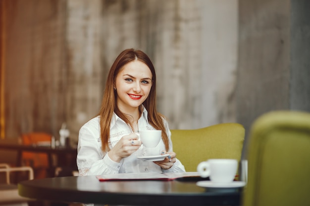 Beautiful girl sitting in a cafe