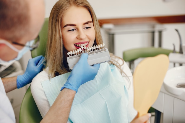 Beautiful girl sitting in the dentist's office