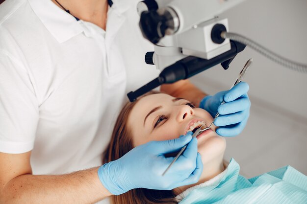 Beautiful girl sitting in the dentist's office