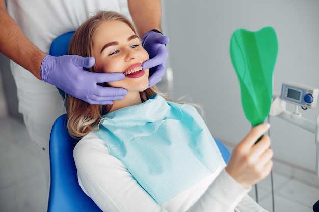 Beautiful girl sitting in the dentist's office