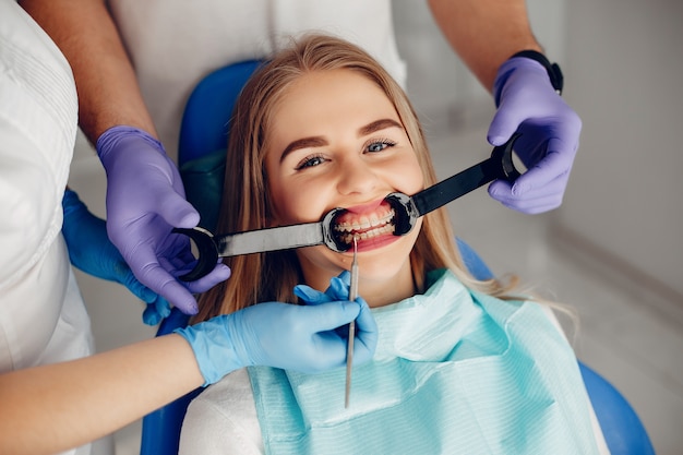 Beautiful girl sitting in the dentist's office